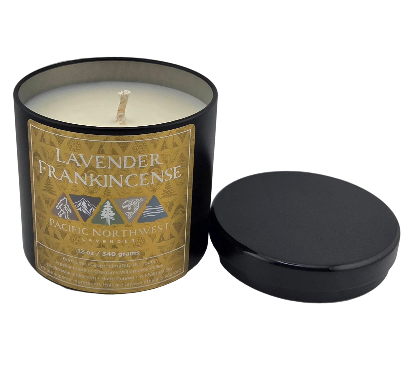 Candle in a black container with a label on a gray background